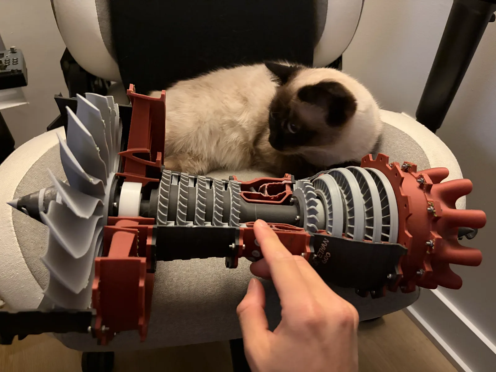 3D-printed cutaway model of the VOILÀ combined-cycle engine — fan, compressor stages, and turbine